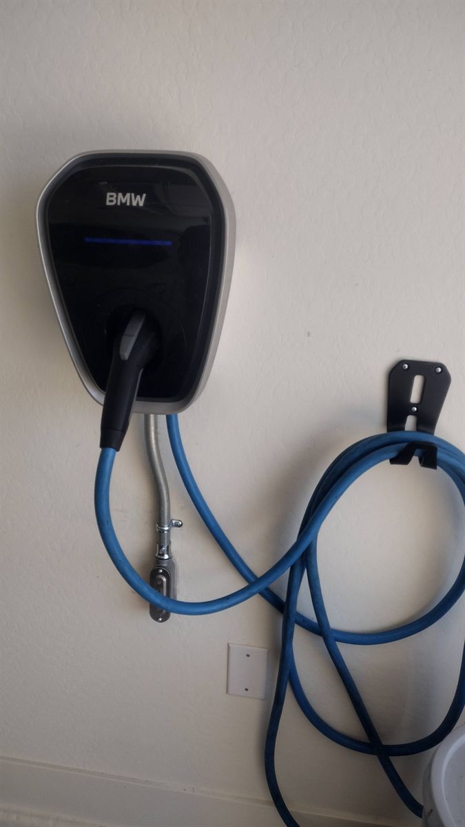 BMW wall charger installed in a home garage