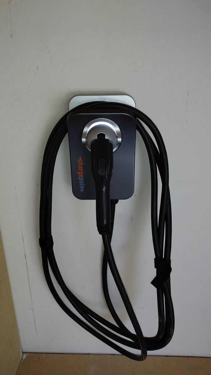 ChargePoint home charger installed on a garage wall