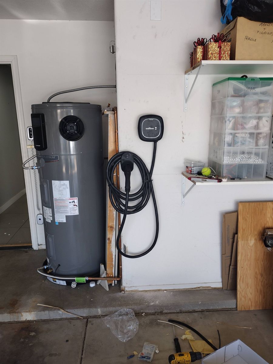 Wallbox charger installed in a garage beside the water heater