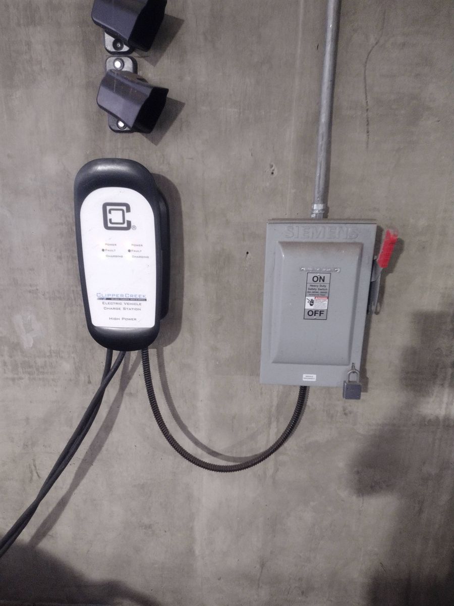 ClipperCreek charging station hardwired beside its own disconnect switch