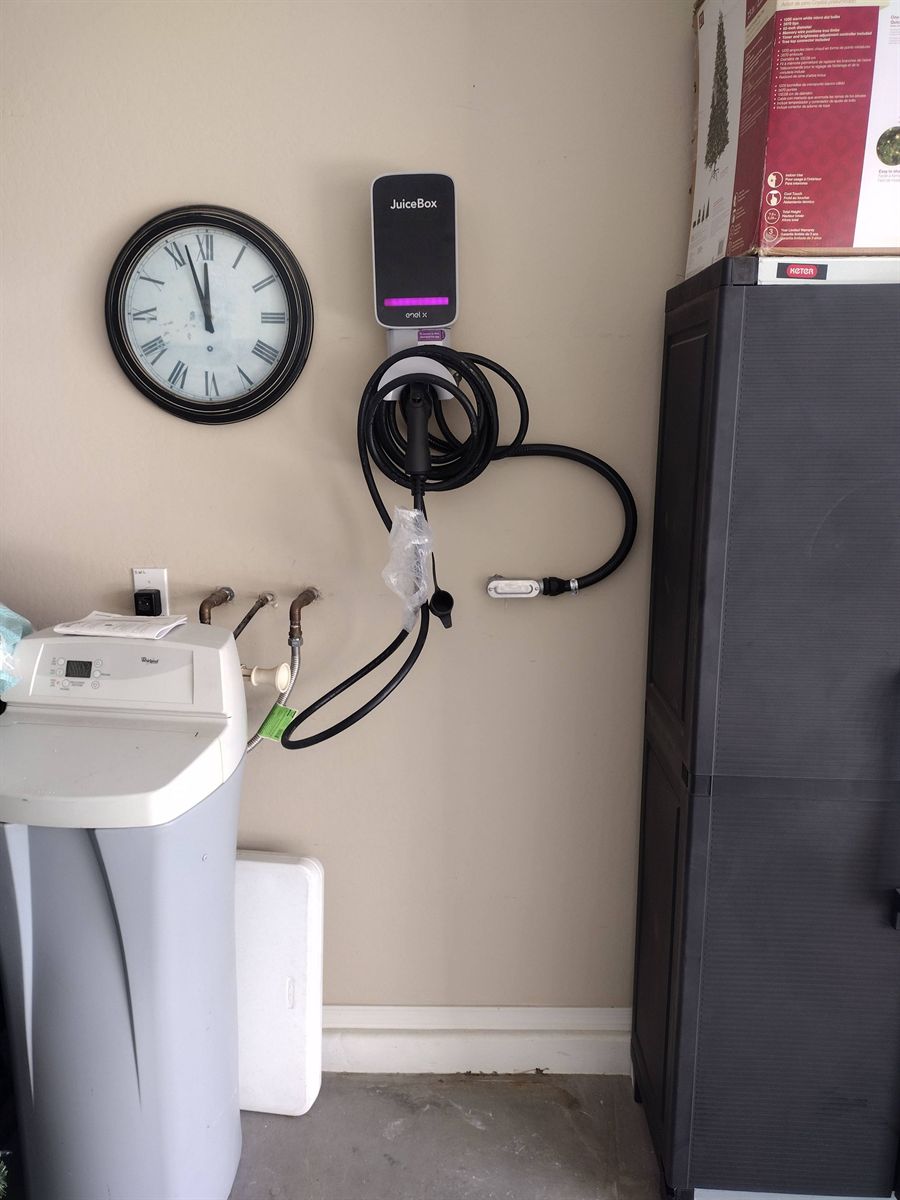JuiceBox charger installed in a home garage