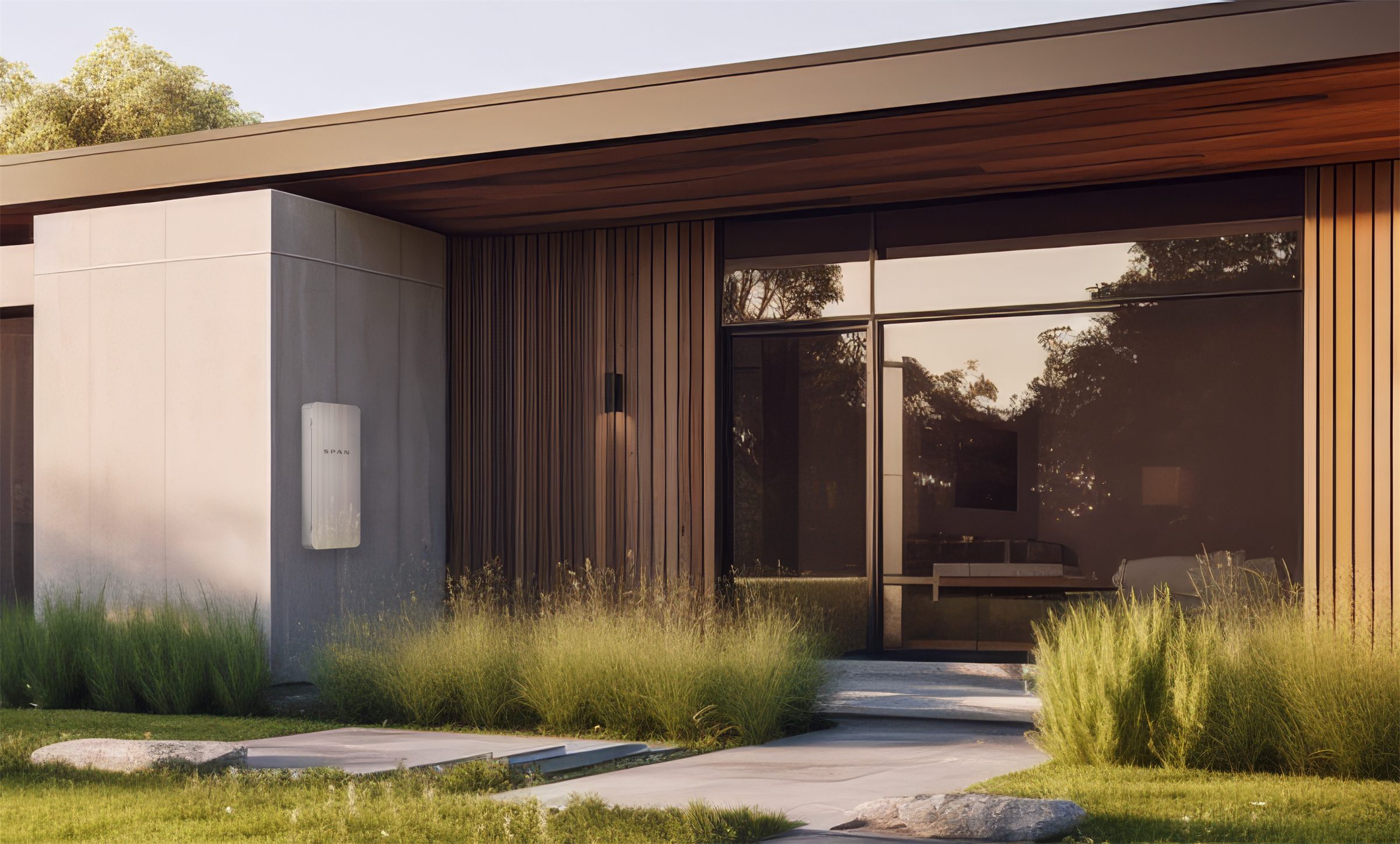 SPAN Panel mounted on the exterior wall of a modern home at golden hour